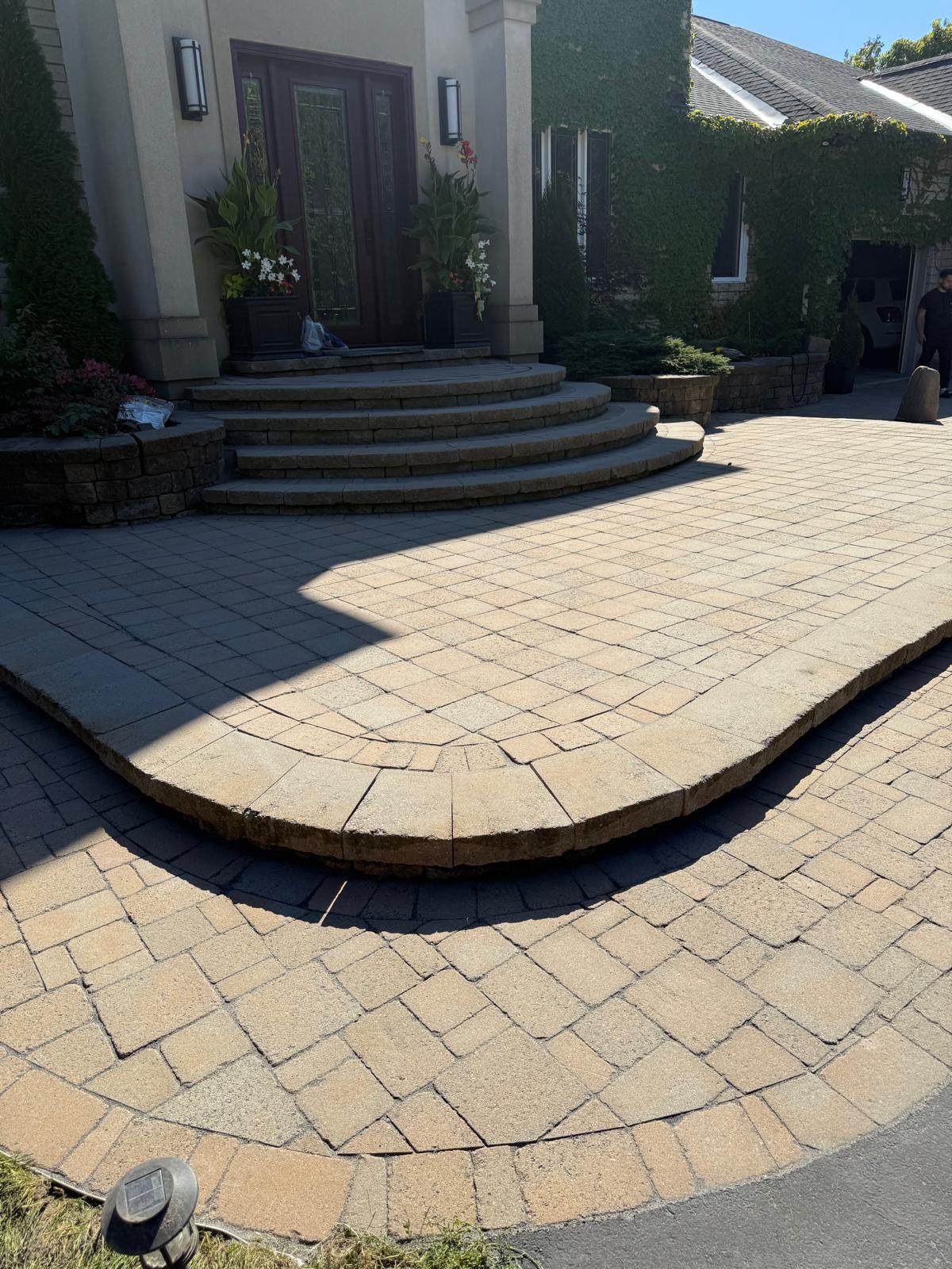 Front entrance staircase with curved steps and retaining wall in Ottawa
